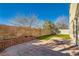 Private backyard with patio and grassy area at 6547 Velvet Silk St, North Las Vegas, NV 89084