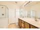 Double vanity bathroom with a shower and tub at 6547 Velvet Silk St, North Las Vegas, NV 89084