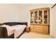 Cozy bedroom with a daybed, wooden cabinet, and ample storage at 6547 Velvet Silk St, North Las Vegas, NV 89084