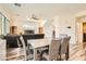 Open concept dining area with gray table and chairs at 6547 Velvet Silk St, North Las Vegas, NV 89084