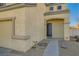 Front entrance with dark-colored door and walkway at 6547 Velvet Silk St, North Las Vegas, NV 89084