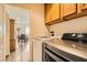 Laundry room with washer, dryer, and view to dining area at 6547 Velvet Silk St, North Las Vegas, NV 89084