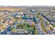 Aerial view of an apartment complex with lush landscaping, resort-style pools, and ample parking at 7151 S Durango Dr # 214, Las Vegas, NV 89113