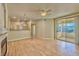 Bright living room with hardwood floors, fireplace, and access to balcony at 7151 S Durango Dr # 214, Las Vegas, NV 89113