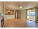 Bright living room with hardwood floors, fireplace, and access to balcony at 7151 S Durango Dr # 214, Las Vegas, NV 89113