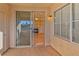 Sliding glass door opens to a private patio with views at 7151 S Durango Dr # 214, Las Vegas, NV 89113