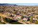 Aerial view of houses near golf course and pond at 8713 Litchfield Ave, Las Vegas, NV 89134