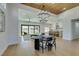 Open concept dining room with hardwood floors and modern dining table at 8713 Litchfield Ave, Las Vegas, NV 89134