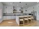 Modern kitchen with white cabinets, a large marble island, and stainless steel appliances at 8713 Litchfield Ave, Las Vegas, NV 89134