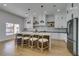 Modern kitchen with white cabinets, a center island, pendant lighting, and stainless steel appliances at 8713 Litchfield Ave, Las Vegas, NV 89134