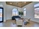 Light-filled living room with arched window, hardwood floors, and stylish seating at 8713 Litchfield Ave, Las Vegas, NV 89134