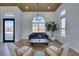 Light-filled living room with arched window, hardwood floors, and stylish seating at 8713 Litchfield Ave, Las Vegas, NV 89134