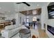 Bright living room featuring a modern fireplace, wood ceiling and a large sectional sofa at 8713 Litchfield Ave, Las Vegas, NV 89134