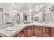 Double vanity bathroom with updated fixtures and mirror at 1550 Desertaire Way, Las Vegas, NV 89110