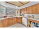 Kitchen with wood cabinets, tile counters, and recessed lighting at 1550 Desertaire Way, Las Vegas, NV 89110