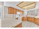 Well-lit kitchen with ample cabinetry and tile flooring at 1550 Desertaire Way, Las Vegas, NV 89110