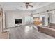 Open living room and kitchen with vaulted ceiling and wood floors at 1550 Desertaire Way, Las Vegas, NV 89110