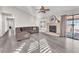 Living room with L-shaped sofa and fireplace at 1550 Desertaire Way, Las Vegas, NV 89110