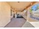 Covered patio with ceiling fan, bar, and seating area at 1550 Desertaire Way, Las Vegas, NV 89110