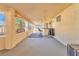 Covered patio with ceiling fan, bar, and seating area at 1550 Desertaire Way, Las Vegas, NV 89110