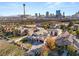 A neighborhood aerial view with views of the Strip, highlighting its mature trees, privacy and manicured grounds at 1725 Bannie Ave, Las Vegas, NV 89102