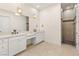 Bright bathroom with dual sink vanity, large mirror, and walk-in shower at 1725 Bannie Ave, Las Vegas, NV 89102