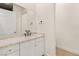 Bright bathroom featuring a vanity with a stone countertop and modern matte black fixtures at 1725 Bannie Ave, Las Vegas, NV 89102