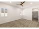 Bright bedroom features neutral carpet, white walls, shuttered windows, and walk-in closet at 1725 Bannie Ave, Las Vegas, NV 89102