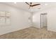 Bright bedroom features neutral carpet, white walls, shuttered windows, and high ceilings at 1725 Bannie Ave, Las Vegas, NV 89102