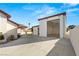 Side angle of the garage and home exterior with exposed garage at 1725 Bannie Ave, Las Vegas, NV 89102