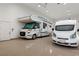 Showcases an oversized garage with high ceilings and ample space for multiple RVs or large vehicles at 1725 Bannie Ave, Las Vegas, NV 89102