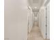 Long hallway with tiled floors and multiple doors leading to other rooms at 1725 Bannie Ave, Las Vegas, NV 89102