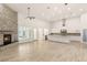 Spacious living room with fireplace and tile flooring showcasing the open floor plan to the kitchen at 1725 Bannie Ave, Las Vegas, NV 89102