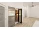 Modern pantry with stainless wine fridge, white cabinets, and tile floors at 1725 Bannie Ave, Las Vegas, NV 89102