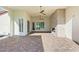 Outdoor patio featuring a stone fireplace, ceiling fans, and decorative paver flooring at 1725 Bannie Ave, Las Vegas, NV 89102