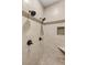 Shower featuring multiple shower heads, neutral stone tile and built-in niche at 1725 Bannie Ave, Las Vegas, NV 89102