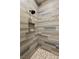 Modern shower with stylish tile, a built-in niche, and pebble-stone shower floor at 1725 Bannie Ave, Las Vegas, NV 89102