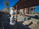 Statuesque backyard with covered patio and angel statue at 2205 Alia Ct, Las Vegas, NV 89102