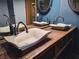 Close-up of double vessel sinks on a rustic wooden vanity at 2205 Alia Ct, Las Vegas, NV 89102