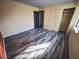 Bright bedroom featuring wood-look tile floors and ample closet space at 2205 Alia Ct, Las Vegas, NV 89102