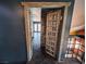 Intriguing doorway with rustic wood door leading into a bright room at 2205 Alia Ct, Las Vegas, NV 89102