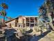 Two-story home with a covered patio and stone fireplace at 2205 Alia Ct, Las Vegas, NV 89102