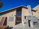 Exterior view of home entrance with stone fireplace at 2205 Alia Ct, Las Vegas, NV 89102