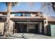 Attached garage with built-in cabinetry and workshop area at 2205 Alia Ct, Las Vegas, NV 89102