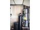 Garage interior with water heater and water softener system at 2205 Alia Ct, Las Vegas, NV 89102