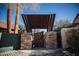 Wrought iron gate with stone pillars and covered entryway at 2205 Alia Ct, Las Vegas, NV 89102