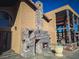 Outdoor stone fireplace and patio area adjacent to the house at 2205 Alia Ct, Las Vegas, NV 89102