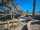 Desert landscaping with a covered patio area at 2205 Alia Ct, Las Vegas, NV 89102