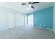 Bright bedroom with a ceiling fan and sliding door to balcony at 3550 Bay Sands Dr # 3061, Laughlin, NV 89029