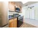 Modern kitchen with stainless steel appliances and wood cabinets at 3550 Bay Sands Dr # 3061, Laughlin, NV 89029